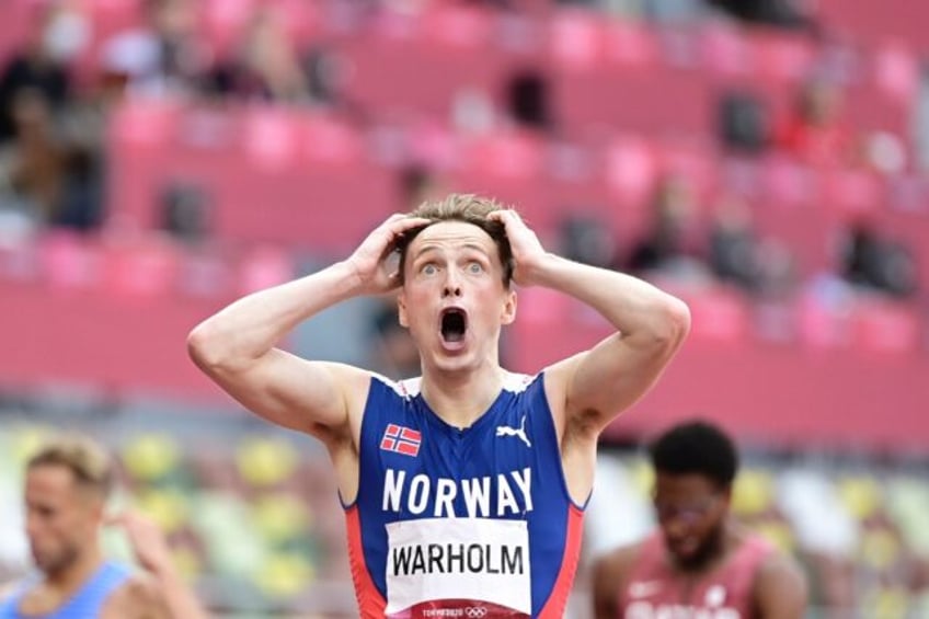 Norway's Karsten Warholm obliterated his own world record to win 400m hurdles Olympic gold