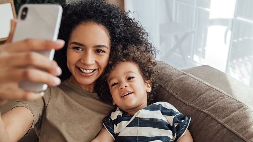 Mom taking selfie with baby