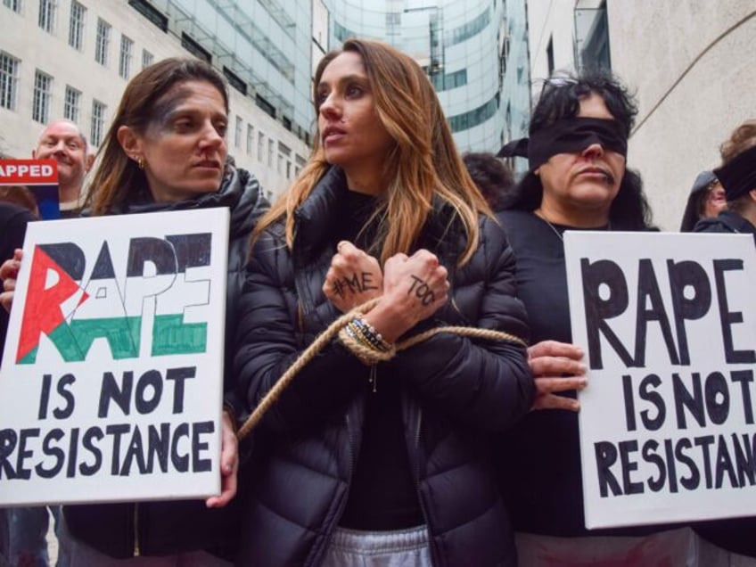 LONDON, UNITED KINGDOM - 2024/02/04: Tied-up protesters and some wearing blindfolds hold p