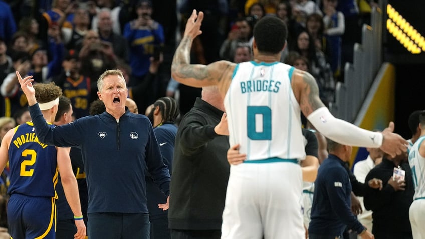 Steve Kerr and Miles Bridges