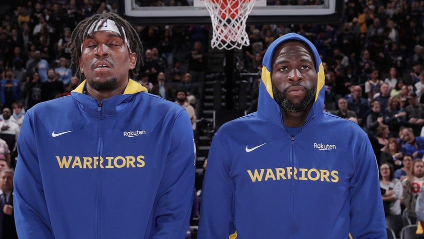 Draymond Green and Kevon Looney listen