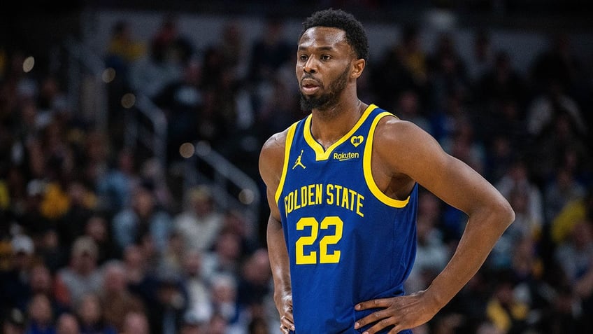 Andrew Wiggins stands on the basketball court