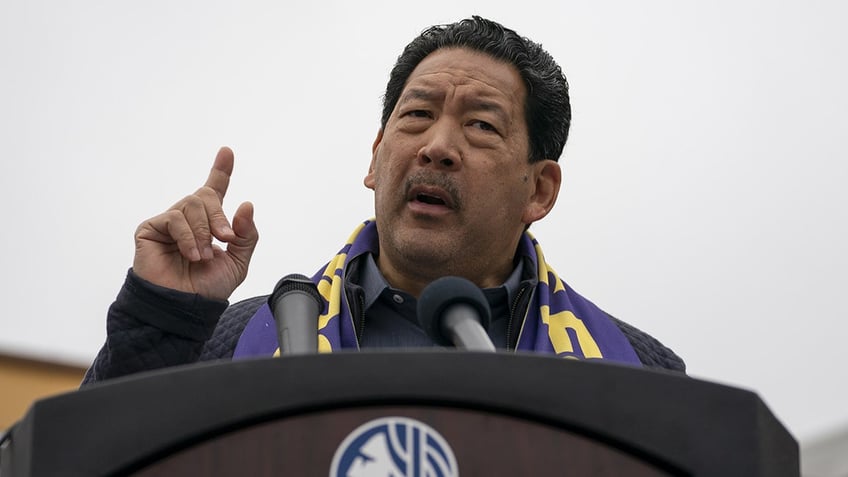 Seattle Mayor Bruce Harrell speaks at a podium