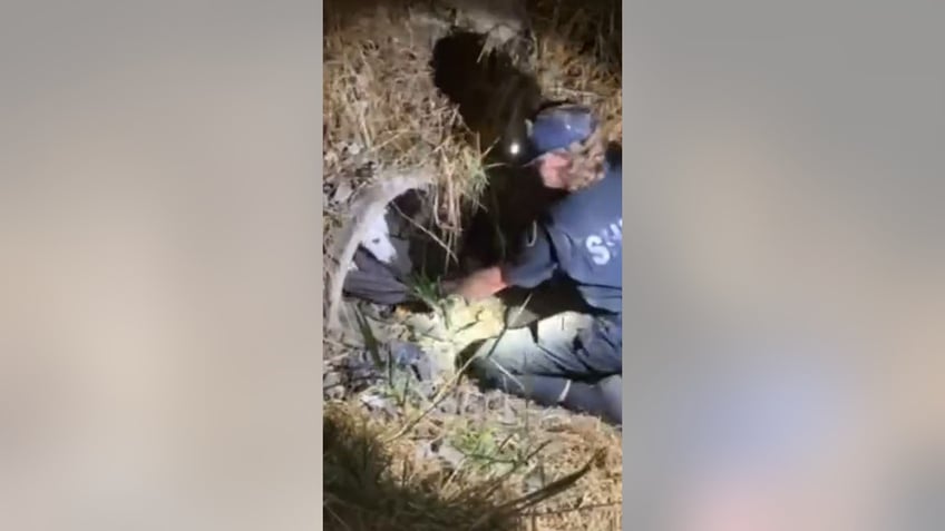 washington deputy crawls into pipe to rescue injured dog