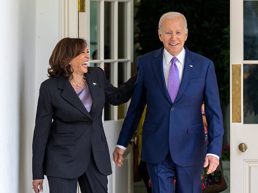 President Joe Biden walks with Vice President Kamala Harris along the West Colonnade of th