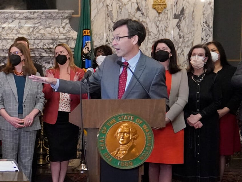 Washington Attorney General Bob Ferguson, right, gestures towards Gov. Jay Inslee, left, d