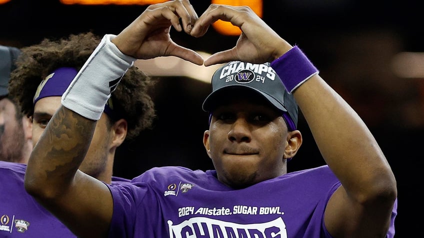 Michael Penix Jr gestures to the crowd