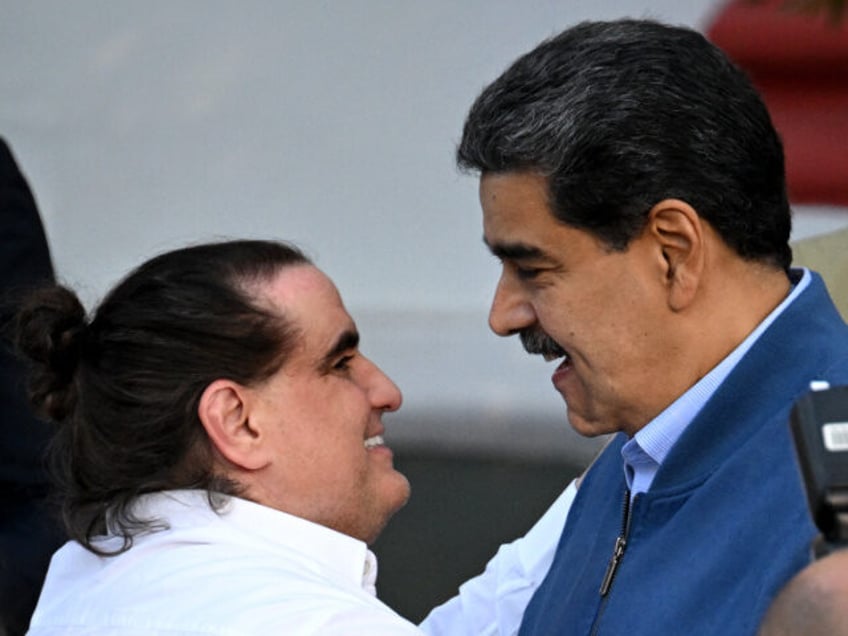 TOPSHOT - Venezuela's President Nicolas Maduro (R) welcomes Colombian businessman Alex Saab at the Miraflores Presidential Palace in Caracas on December 20, 2023. Saab, alleged to be a "front man" for Venezuelan President Nicolas Maduro, arrived in the Caribbean country after being released from the United States, where he was …