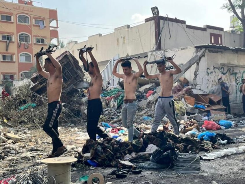 Palestinian terrorists surrender at the Kamal Adwan Hospital in northern Gaza after several days of fighting, December 14, 2023 (IDF / ISA)