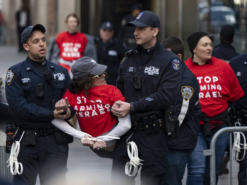 NEW YORK, USA - MARCH 13: NYPD officers arrest activists from the group Jewish Voices for
