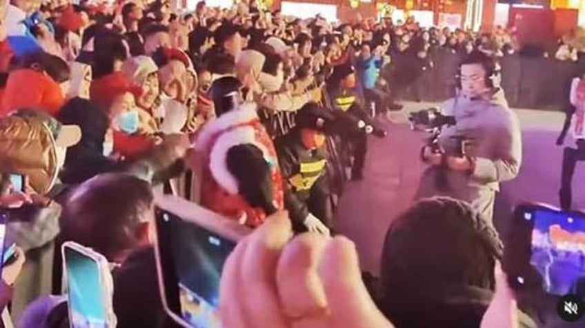 watch ai robot attacks crowd in china