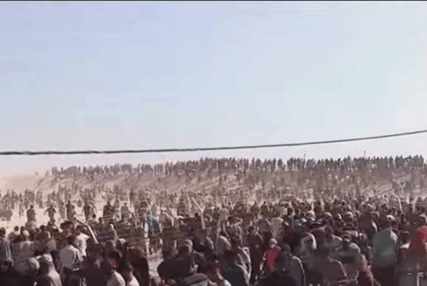 watch american contractors throw stun grenades at gazans outside aid site