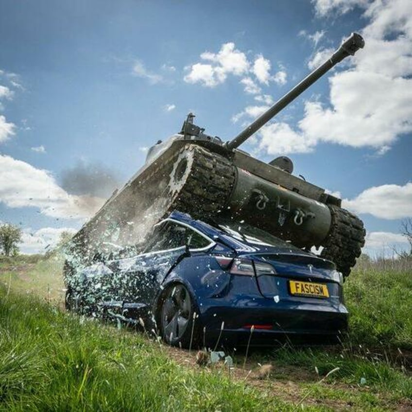 watch anti musk activists crush tesla with tank in politically motivated stunt