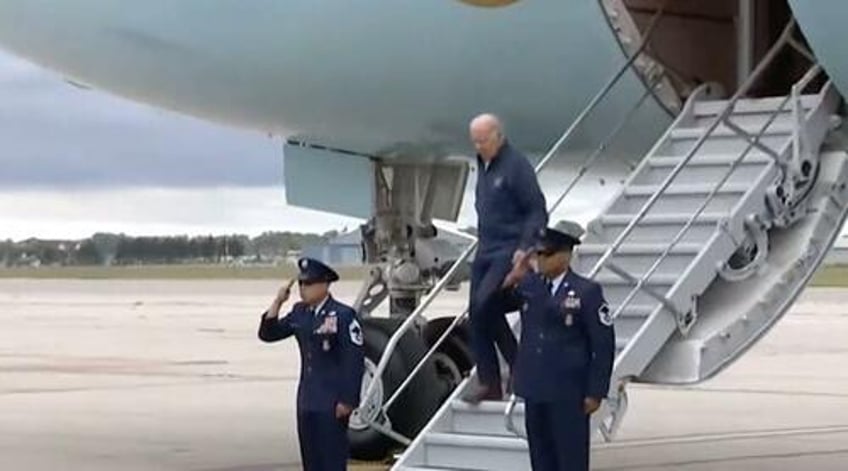 watch biden almost falls down steps on same day as report about handlers mission to prevent him falling