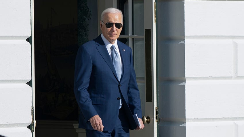 watch biden ignores reporters when pressed on hunters new indictment