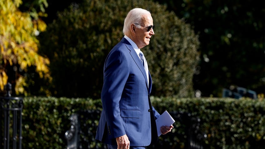 watch biden ignores reporters when pressed on hunters new indictment