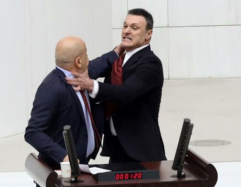 watch bloody brawl in turkeys parliament left lawmakers injured even women were punched 