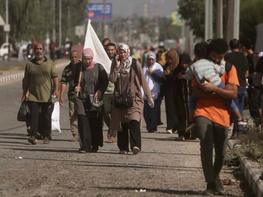 watch civilians evacuate northern gaza as israel opens humanitarian corridor