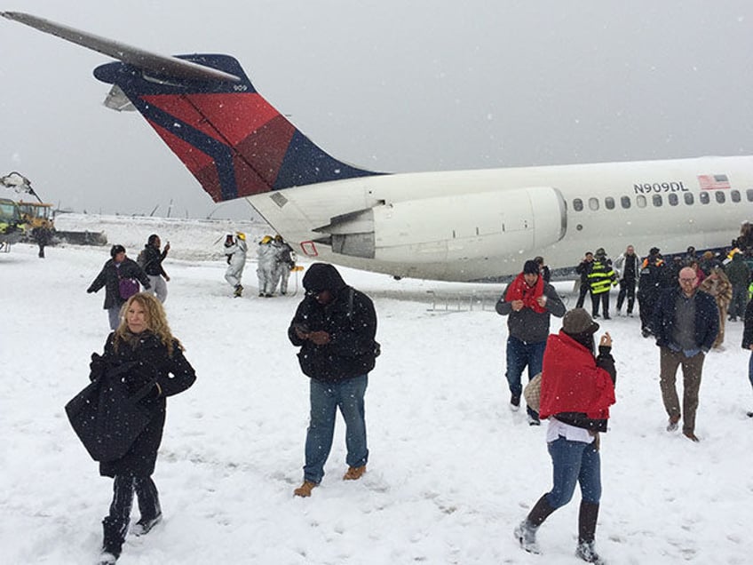 A plane arriving in New York City amid snowy conditions skidded off the runway at LaGuardi