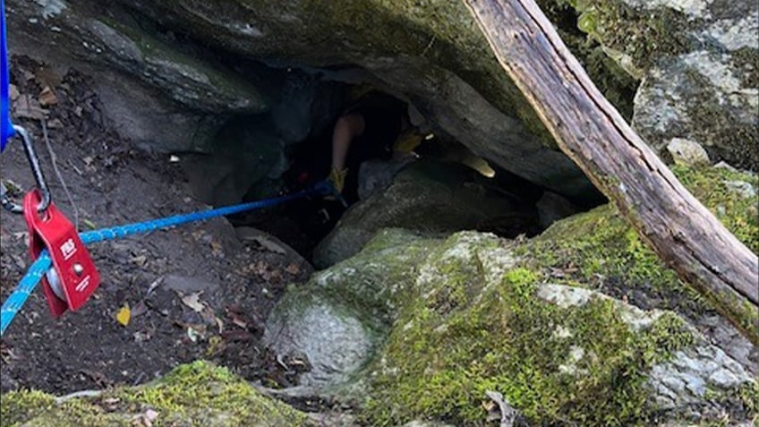 watch dramatic rescue of trapped tennessee dog named charlie just 5 feet below bear in deep cave