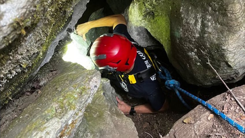 watch dramatic rescue of trapped tennessee dog named charlie just 5 feet below bear in deep cave