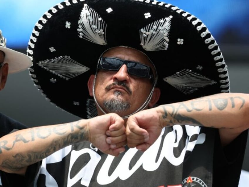 LOS ANGELES, CALIFORNIA - SEPTEMBER 08: A Las Vegas Raiders dances in the stands before th