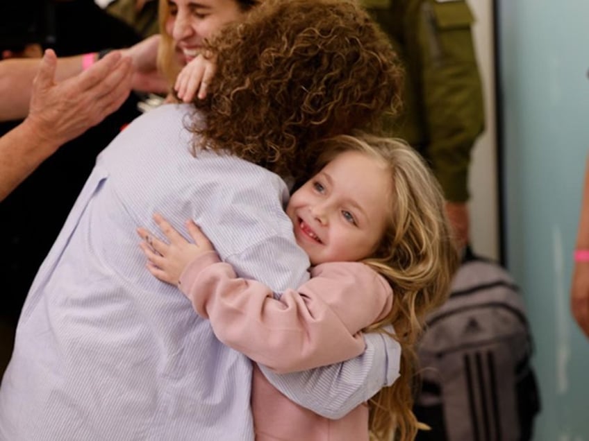 watch first families reunited after israeli hostages freed