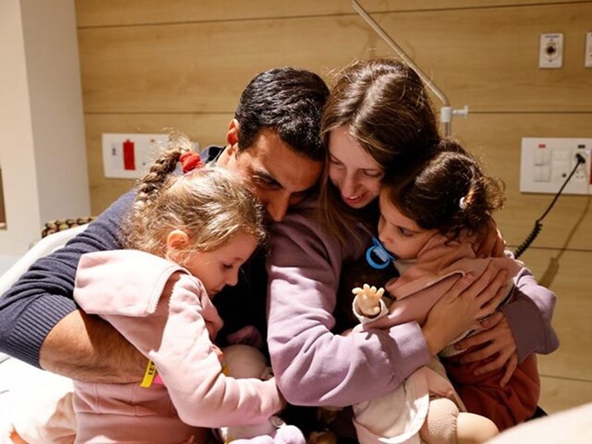 watch first families reunited after israeli hostages freed