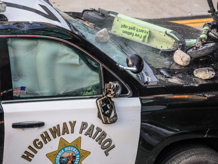 Los Angeles, CA, Sunday, June 8, 2025 - Rocks and a scooter thrown from an overpass lay on