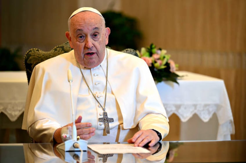 Pope Francis, flanked by Msgr. Paolo Braida delivers his Sunday Angelus blessing from his residence at the Casa Santa Marta on November 26, 2023 in...