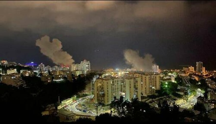 watch hezbollah unleashes massive missile strikes on israels haifa