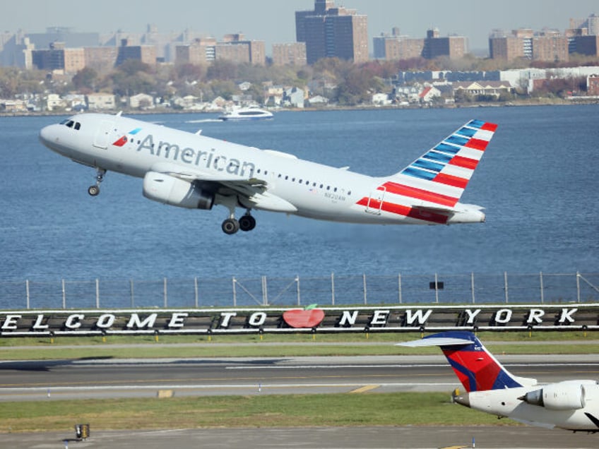 An American Airlines jet takes off at Laguardia AIrport on November 10, 2022 in the Queens