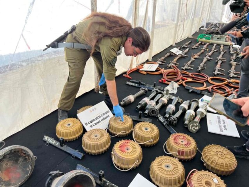 watch idf reveals arsenal of weapons seized from hamas anti tank explosives used to kill civilians