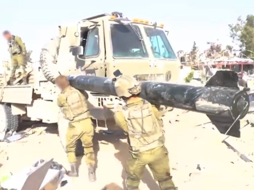 watch idf uncovers large hamas weapons cache in gaza including rockets