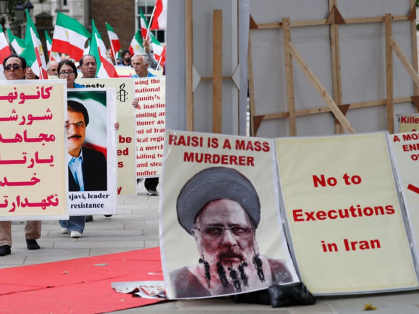 Protesters carry banners during a demonstration organised by supporters of the National Co