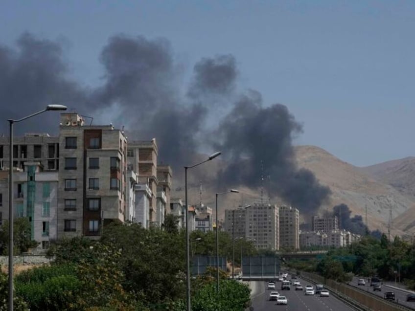 Smoke rises from an oil storage facility after it appeared to have been struck by an Israe