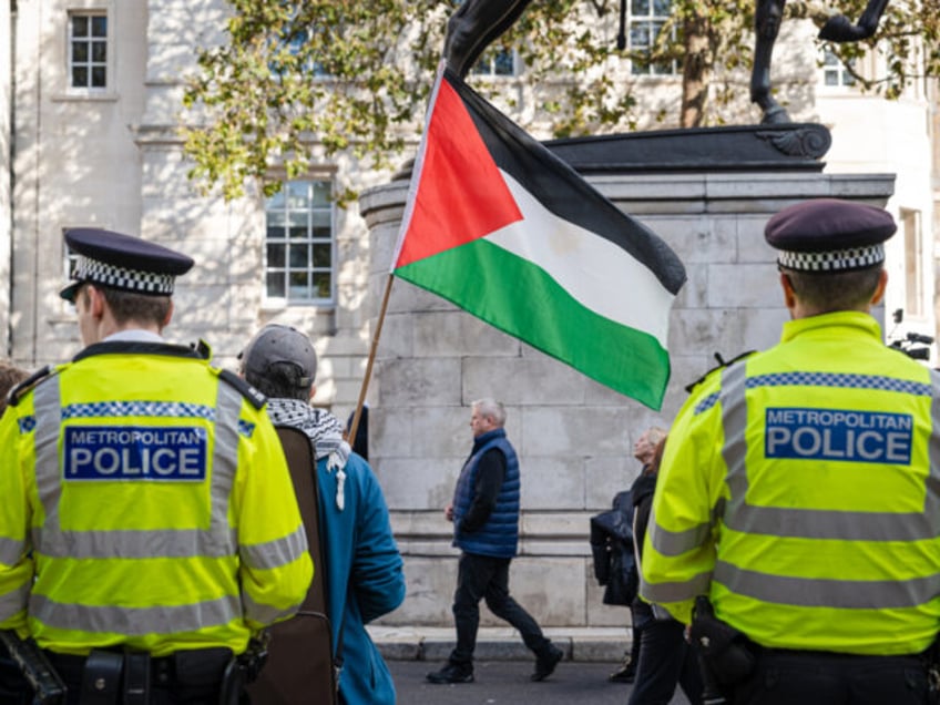 watch man arrested after complaining about palestinian flags flying in london criticising mass migration
