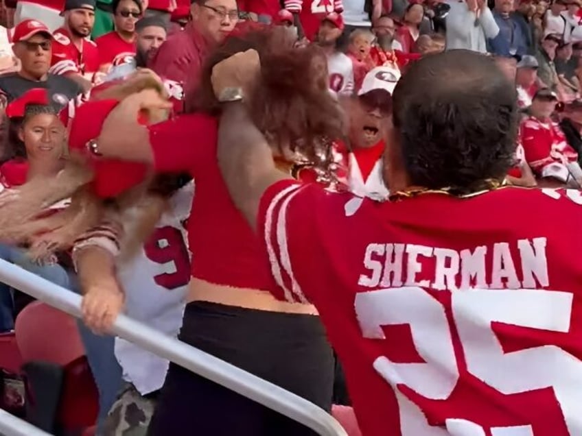 watch man pulls woman by the hair during wild fight among 49ers fans