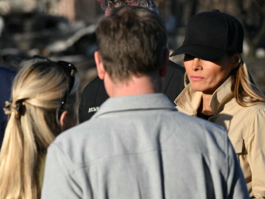 US President Donald Trump and First Lady Melania Trump meet residents as they tour a fire-