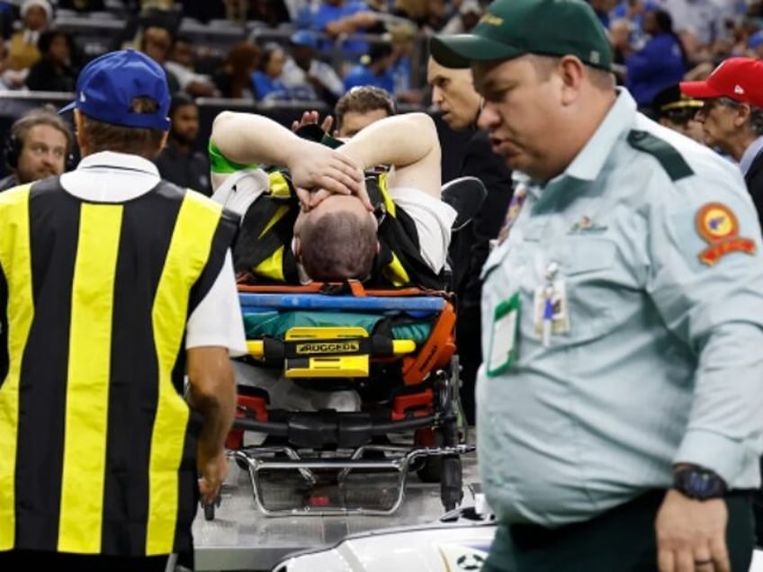 watch nfl sideline official suffers gruesome leg fracture during saints lions game