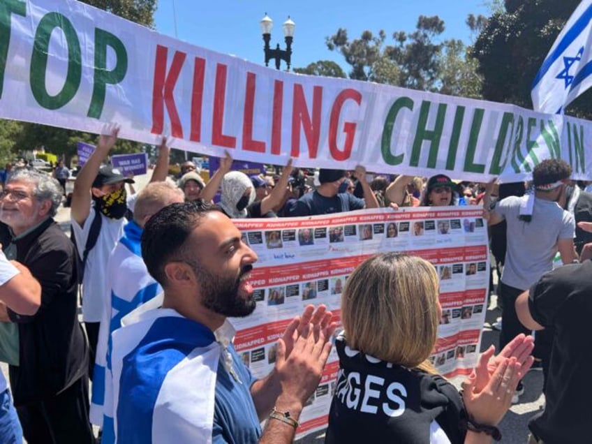 watch pro israel pro palestinian protesters clash at ucla encampment