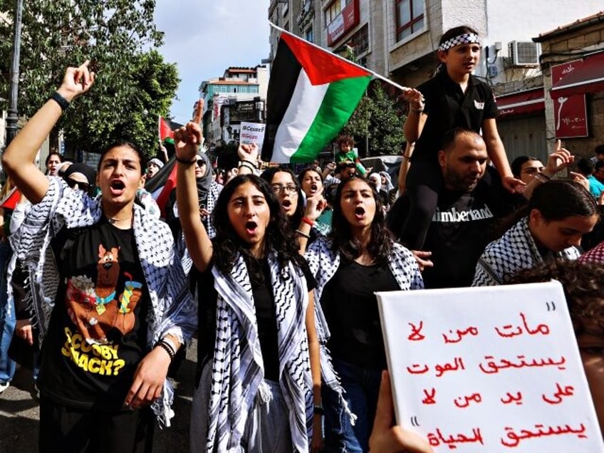 Palestinians chant slogans in support of the people in the Gaza Strip amid ongoing battles between Israel and the Palestinian Hamas movement, during a march in Ramallah in the occupied West Bank on November 1, 2023. (Photo by Zain JAAFAR / AFP) (Photo by ZAIN JAAFAR/AFP via Getty Images)