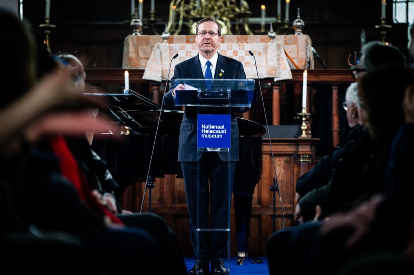 Israeli President Isaac Herzog (C) delivers a speech during an opening ceremony for the National Holocaust Museum, at the Portuguese Synagogue in Amsterdam, on March 10, 2024. Eighty years after World War II, the Netherlands is poised to open its first Holocaust museum, as before the war and the Nazi occupation, the Netherlands was home to a vibrant Jewish community of around 140,000 people, mainly concentrated in Amsterdam and by the time the Holocaust was over, an estimated 75 percent -- 102,000 people -- had been murdered. (Photo by Bart Maat / ANP / AFP) / Netherlands OUT (Photo by BART MAAT/ANP/AFP via Getty Images)