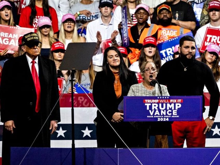 Former US President Donald Trump, left, and Carmen Ramirez, mother of Minelys "Mimi&q