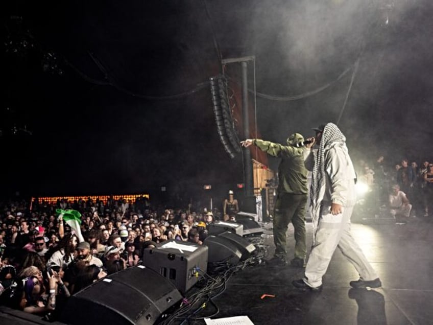 INDIO, CALIFORNIA - APRIL 18: (FOR EDITORIAL USE ONLY) Members of the band Kneecap includi