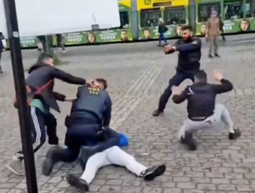 watch shocking video shows german politician stabbed during campaign event in mannheim