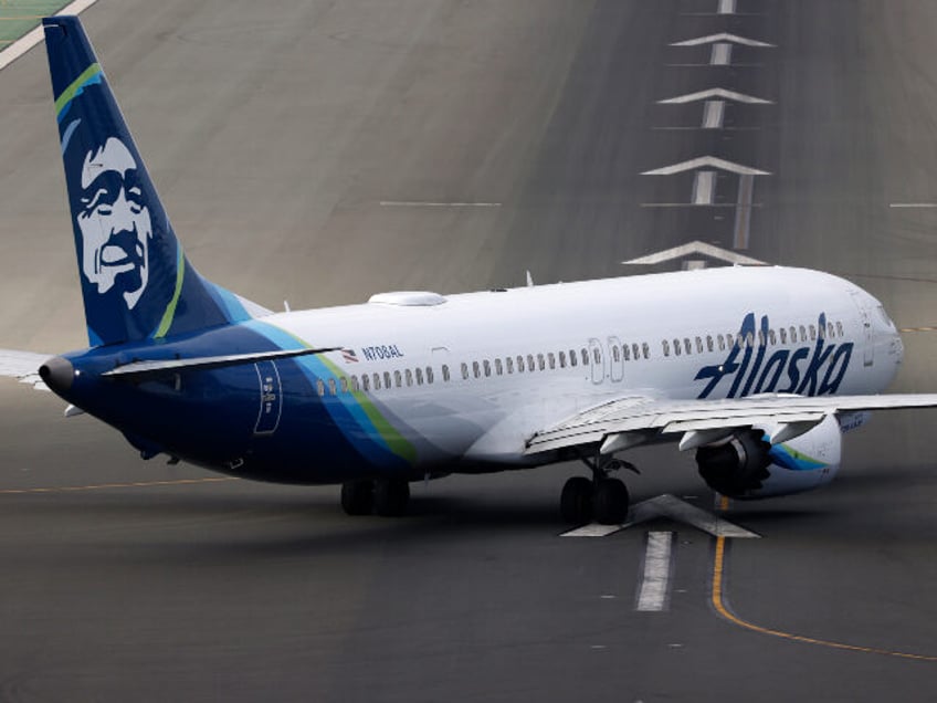 An Alaska Airlines Boeing 737 MAX 9 airplane taxis on the runway before departing from San