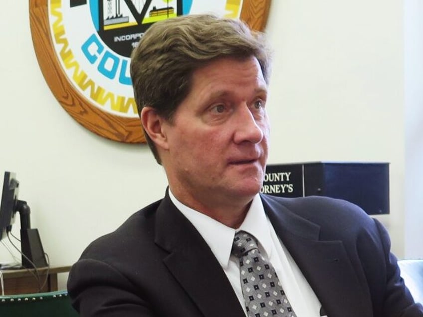 HOLD FOR IVAN MORENO STORY MOVING SUNDAY In this May 19, 2017 photo, Milwaukee County District Attorney John Chisholm talks in his office about the benefits of placing prosecutors with police officers in neighborhoods to address crime and seek alternatives to prison. (AP Photo/Ivan Moreno)