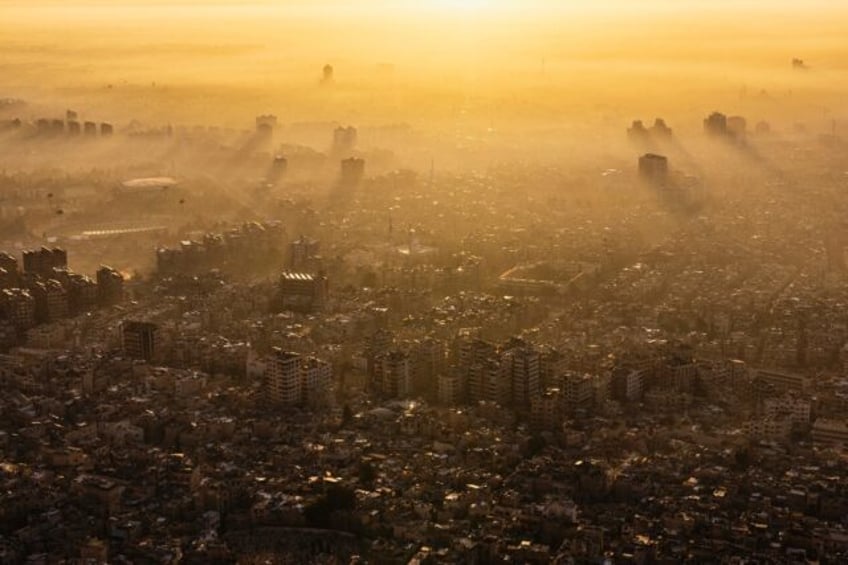 Damascus is seen at sunrise from Mount Qasyun, which for years was off limits to regular p