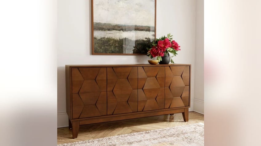 Put this elegantly crafted sideboard in your living room. 